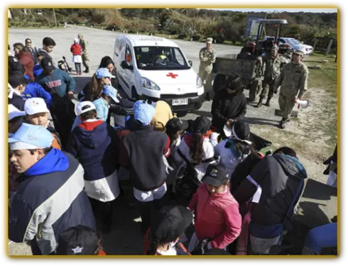 Schoolchildren from nearby areas and students from General Artigas Military High School participating in environmental awareness activities at La Moza Beach in Santa Teresa National Park